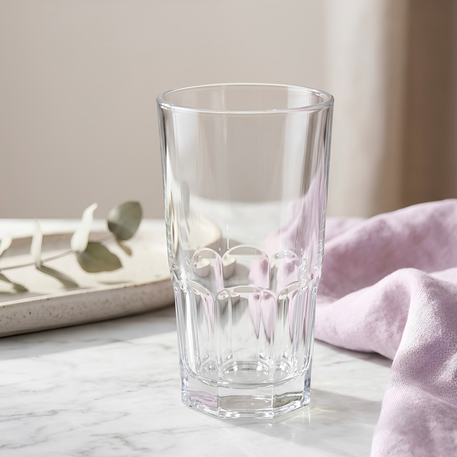 Shop Del clear glass tumbler on white marble background by Rayan Glass