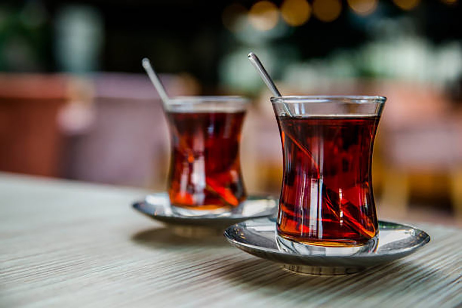 Turkish tea in national glass tea cups. Eastern oriental traditions, Turkey. Selective focus, shallow depth. Copy space.